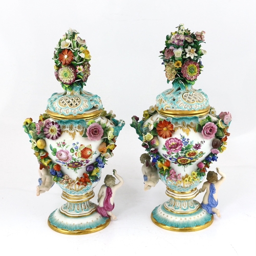 130 - A pair of Meissen topographical flower encrusted vases and covers, 19th century, each painted with t... 