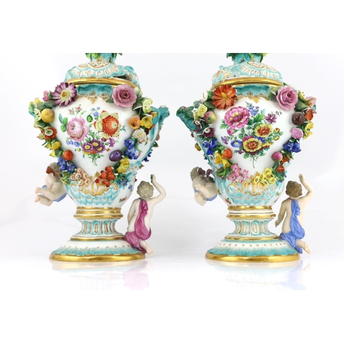 130 - A pair of Meissen topographical flower encrusted vases and covers, 19th century, each painted with t... 