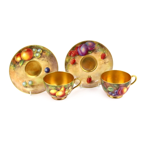 145 - A pair of Royal Worcester fruit painted tea cups and saucers, 1960s, the cups signed J. Smith and E.... 