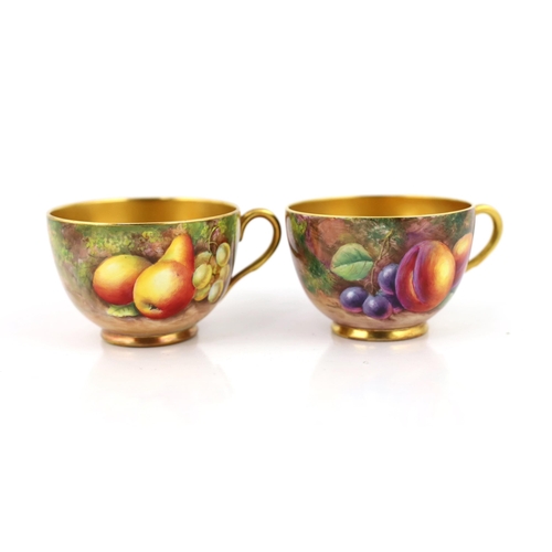 145 - A pair of Royal Worcester fruit painted tea cups and saucers, 1960s, the cups signed J. Smith and E.... 