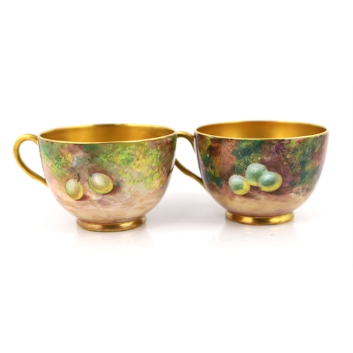 145 - A pair of Royal Worcester fruit painted tea cups and saucers, 1960s, the cups signed J. Smith and E.... 