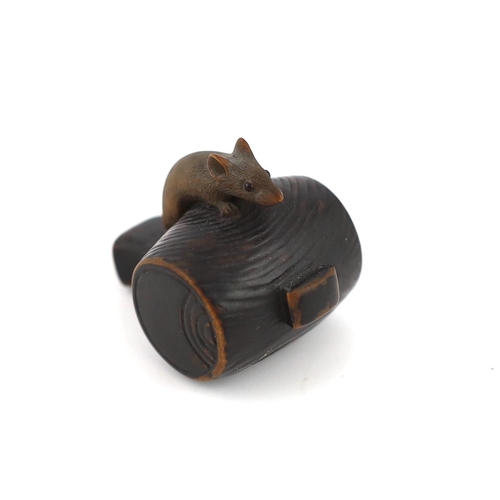 147 - * * A Japanese carved wood rat netsuke, early 19th century, formed as a rat, with inlaid eyes, resti... 