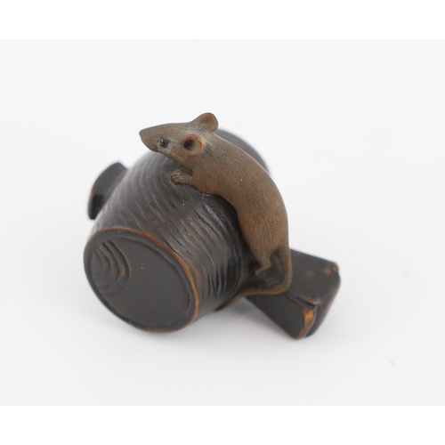 147 - * * A Japanese carved wood rat netsuke, early 19th century, formed as a rat, with inlaid eyes, resti... 