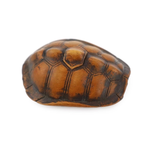 149 - * * A Japanese carved wood netsuke of a turtle shell, mid 19th century, the upper part of the himato... 