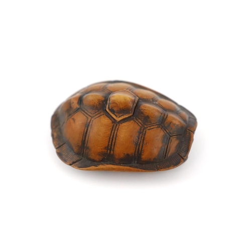 149 - * * A Japanese carved wood netsuke of a turtle shell, mid 19th century, the upper part of the himato... 