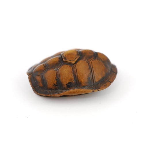 149 - * * A Japanese carved wood netsuke of a turtle shell, mid 19th century, the upper part of the himato... 