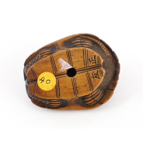 149 - * * A Japanese carved wood netsuke of a turtle shell, mid 19th century, the upper part of the himato... 