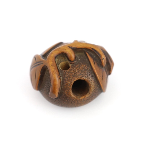 151 - * * A Japanese carved wood netsuke of a pumpkin with a stalk and leaves, 19th century, signed Tomono... 