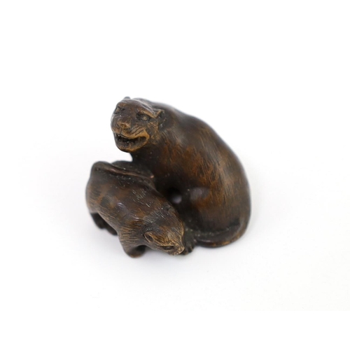 152 - * * A Japanese carved wood netsuke of a tiger and cub, 19th century, unsigned, 2.2cmProvenance: J. H... 