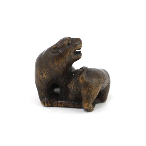 152 - * * A Japanese carved wood netsuke of a tiger and cub, 19th century, unsigned, 2.2cmProvenance: J. H... 