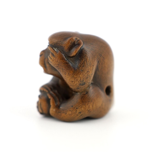 153 - * * A Japanese carved wood netsuke of an ape, Tamba School, 19th century, with inlaid eyes, 3.4cmPro... 