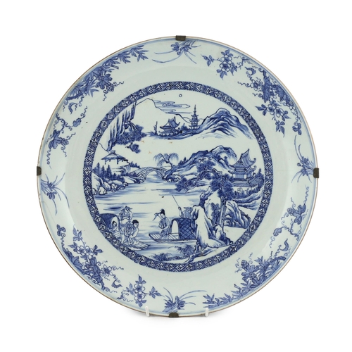 159 - A Chinese blue and white landscape dish, Yongzheng/Qianlong period, finely drawn and painted with fi... 