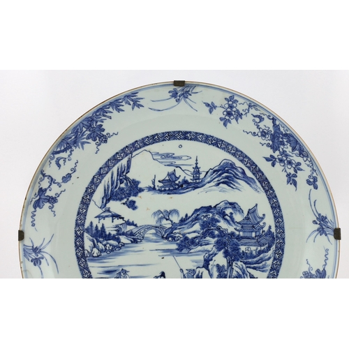 159 - A Chinese blue and white landscape dish, Yongzheng/Qianlong period, finely drawn and painted with fi... 