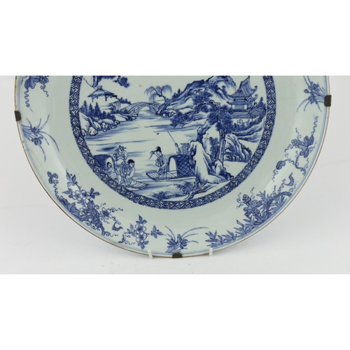 159 - A Chinese blue and white landscape dish, Yongzheng/Qianlong period, finely drawn and painted with fi... 