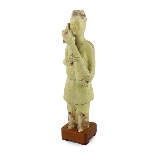 171 - * * A Chinese pale green glazed pottery figure of an attendant, Tang dynasty (618-906 AD), standing ... 