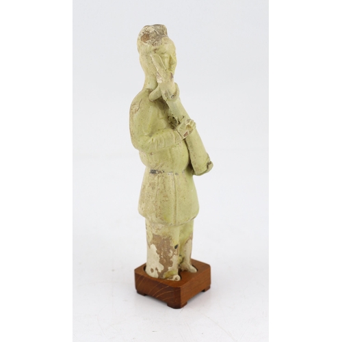 171 - * * A Chinese pale green glazed pottery figure of an attendant, Tang dynasty (618-906 AD), standing ... 