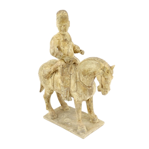 173 - * * A Chinese cream glazed pottery model of an archer on horseback, Tang Dynasty (618-906 AD), 31cmP... 