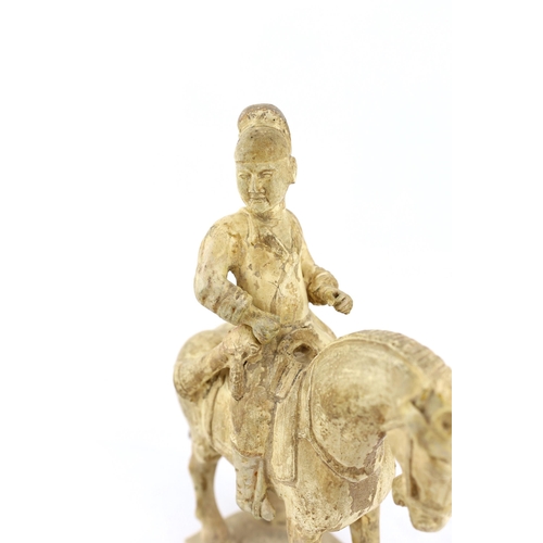 173 - * * A Chinese cream glazed pottery model of an archer on horseback, Tang Dynasty (618-906 AD), 31cmP... 