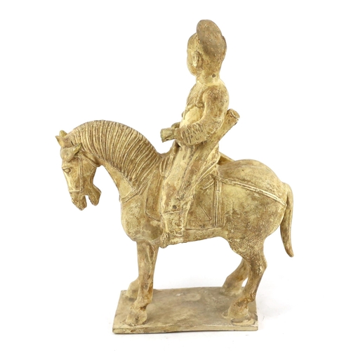 173 - * * A Chinese cream glazed pottery model of an archer on horseback, Tang Dynasty (618-906 AD), 31cmP... 