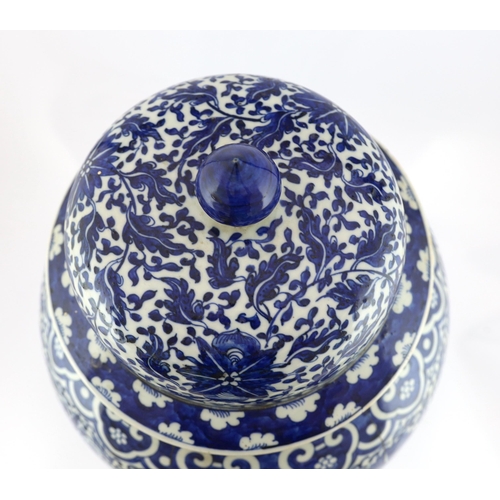 177 - A massive Chinese blue and white lotus vase and cover, 18th/19th century, the shoulder with repeat... 