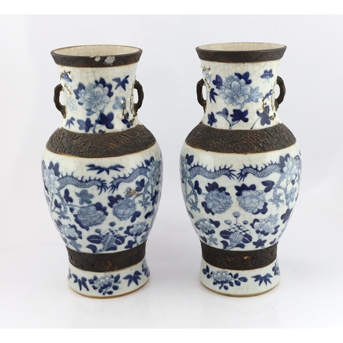 188 - A pair of large Chinese blue and white crackle-glaze dragon vases, early 20th century, each painte... 