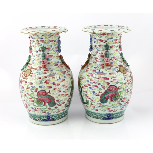 191 - A pair of Chinese enamelled porcelain 'dragon and Buddhist lion' vases, 19th century, each painted w... 