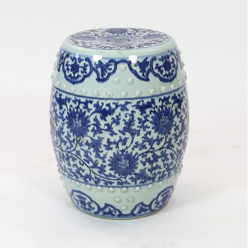 199 - A Chinese blue and white porcelain stool, 19th century, painted with lotus flowers and scrolling fol... 