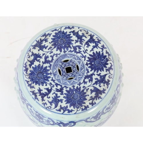 199 - A Chinese blue and white porcelain stool, 19th century, painted with lotus flowers and scrolling fol... 