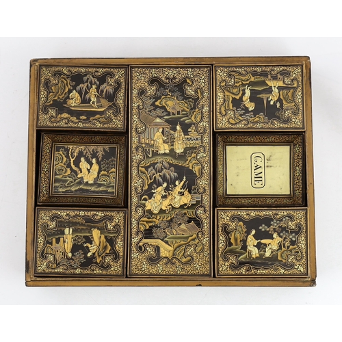 205 - A Chinese gilt-decorated black lacquer games box, mid 19th century, the cover and side panels decora... 