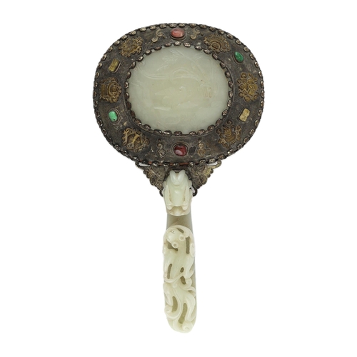 211 - A Chinese celadon jade mounted hand mirror, the jade 18th/19th century, the back of the mirror cast ... 