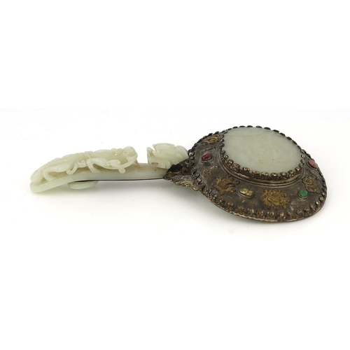 211 - A Chinese celadon jade mounted hand mirror, the jade 18th/19th century, the back of the mirror cast ... 