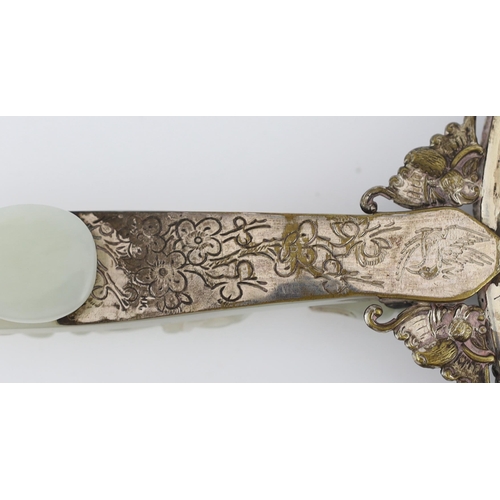 211 - A Chinese celadon jade mounted hand mirror, the jade 18th/19th century, the back of the mirror cast ... 