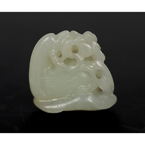 212 - * * A Chinese small white jade carving of a stylised duck, late Qing dynasty, clasping a sprig of lo... 