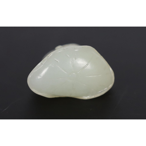 212 - * * A Chinese small white jade carving of a stylised duck, late Qing dynasty, clasping a sprig of lo... 