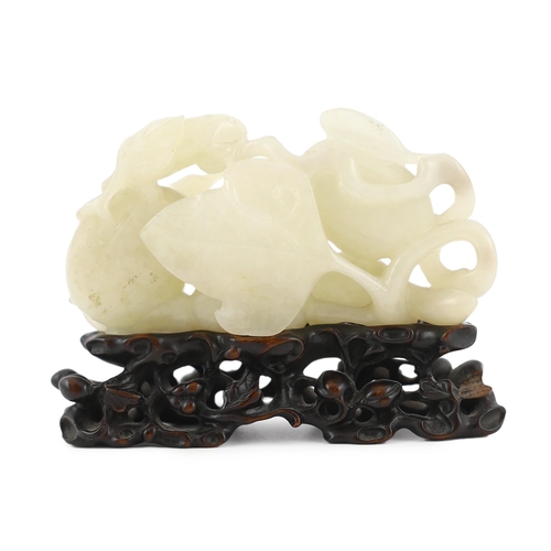 213 - * * A Chinese white jade carving of a cluster of melons, 18th century, with stalks and leaves, two s... 