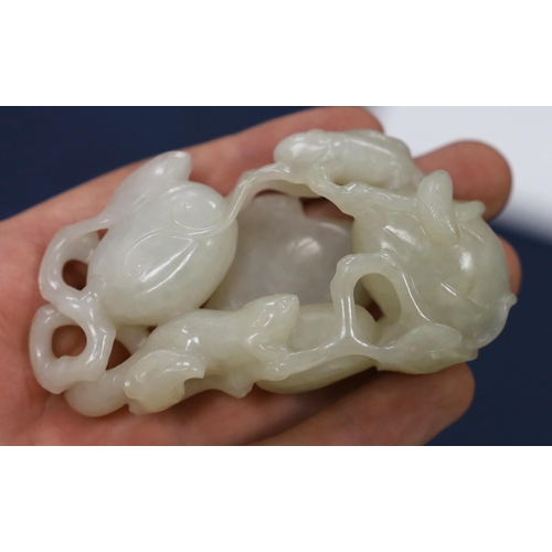 213 - * * A Chinese white jade carving of a cluster of melons, 18th century, with stalks and leaves, two s... 