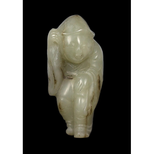 215 - * * A Chinese white jade figure of a boy wearing a hat and long coat, Ming dynasty, the stone with b... 