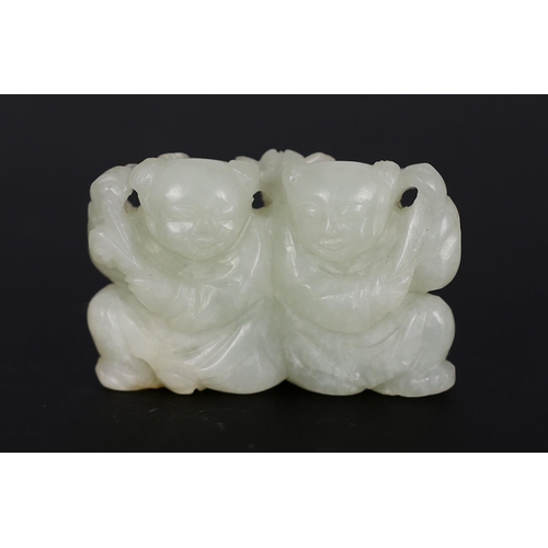 219 - * * A Chinese pale celadon jade carving of the He He Erxian twins, 18th/19th century, one boy holdin... 