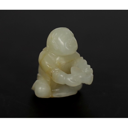 220 - * * A Chinese white and russet carved jade figure of Liu Hai, 17th century, modelled kneeling, with ... 