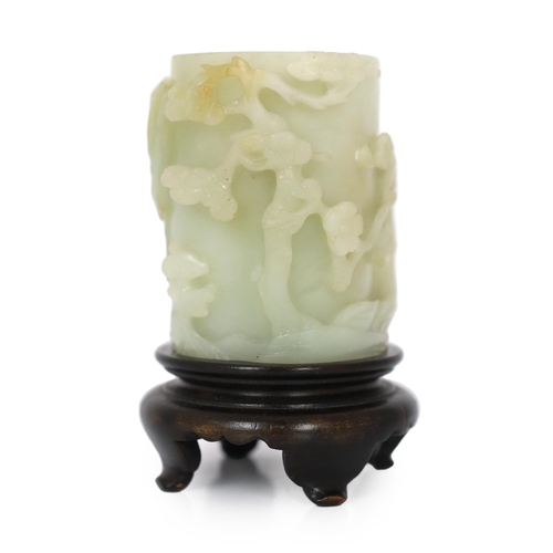 224 - * * A Chinese pale celadon and russet jade brush pot, bitong, 18th century, worked in deep relief wi... 