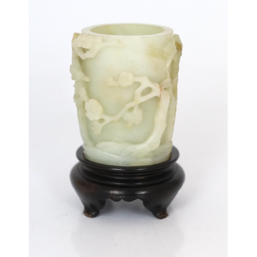 224 - * * A Chinese pale celadon and russet jade brush pot, bitong, 18th century, worked in deep relief wi... 