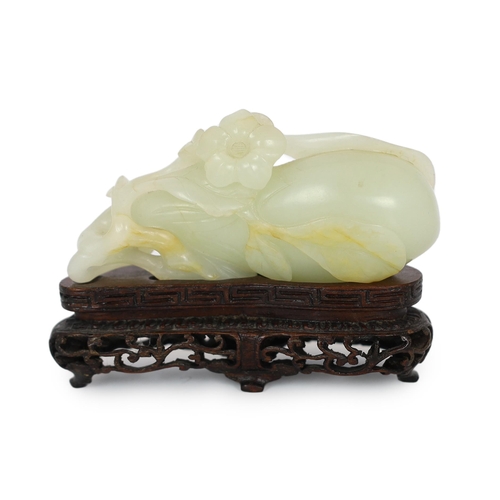 225 - * * A Chinese pale celadon jade carving of a fruit, 18th century, with stalks and leaves, a flower t... 