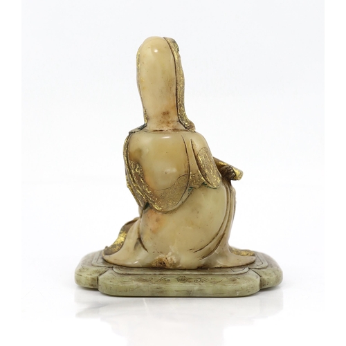 227 - A Chinese soapstone seated figure of Guanyin, 17th/18th century, holding a scroll in the left hand a... 