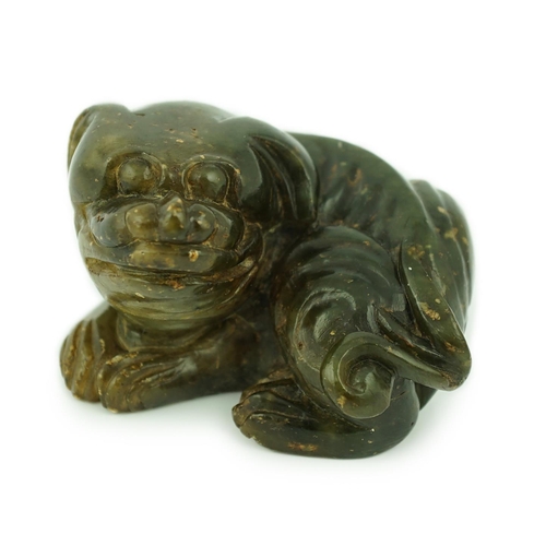 234 - A Chinese Ming green soapstone figure of a recumbent lion-dog, 16th/17th century, 7.5cm long