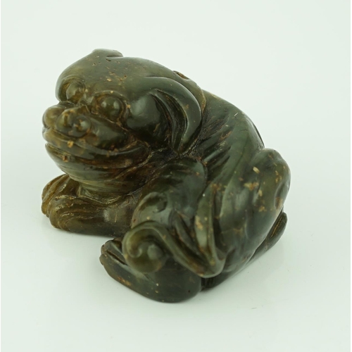 234 - A Chinese Ming green soapstone figure of a recumbent lion-dog, 16th/17th century, 7.5cm long