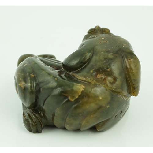 234 - A Chinese Ming green soapstone figure of a recumbent lion-dog, 16th/17th century, 7.5cm long