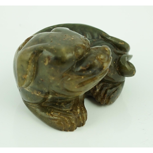 234 - A Chinese Ming green soapstone figure of a recumbent lion-dog, 16th/17th century, 7.5cm long