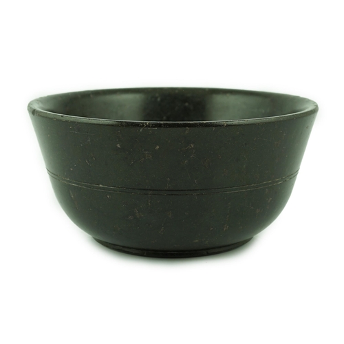 237 - A Chinese snakeskin soapstone bowl, Tang dynasty or later, of plain form with ring turning to the mi... 