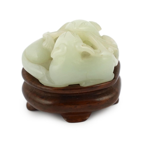 238 - A Chinese pale celadon jade group of two badgers, 18th/19th century, each biting a sprig of lingzhi ... 