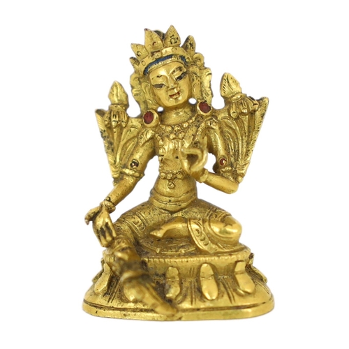 245 - * * A Tibetan miniature gilt bronze figure of Green Tara, 18th/19th century, 3cm highProvenance: G. ... 